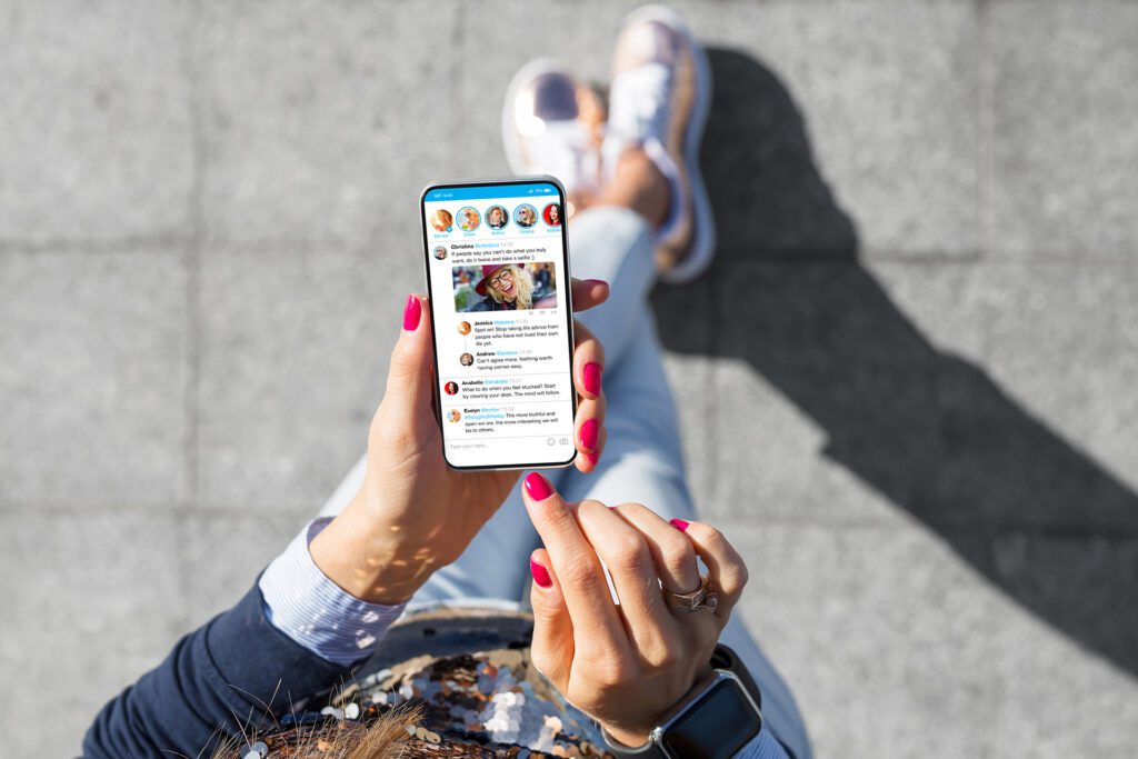 Woman using social media on her phone